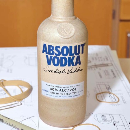 The new paper bottle for Absolut Vodka, sitting on a desk