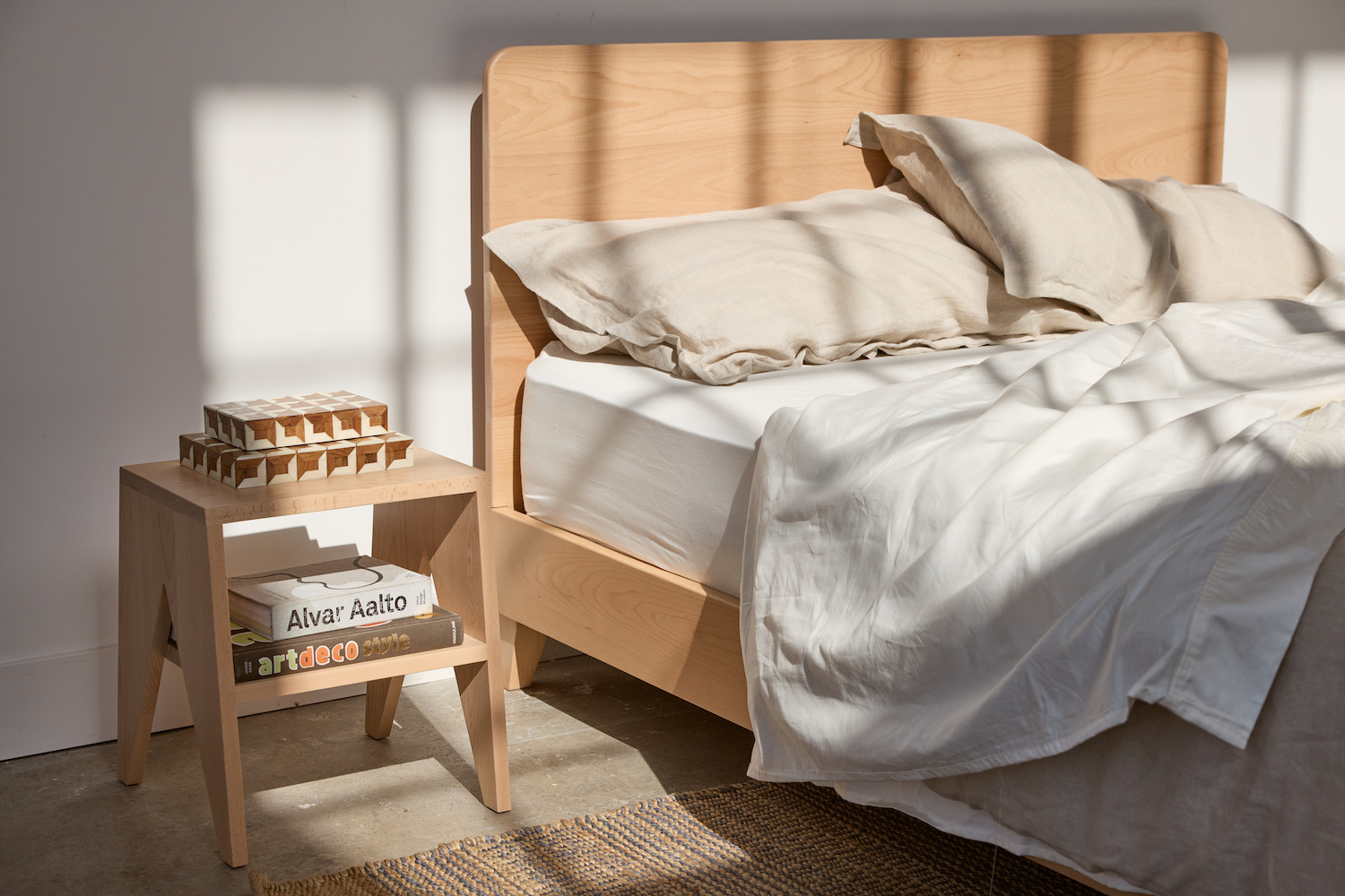 a sunlit night stand and bed frame from the Avocado City Collection