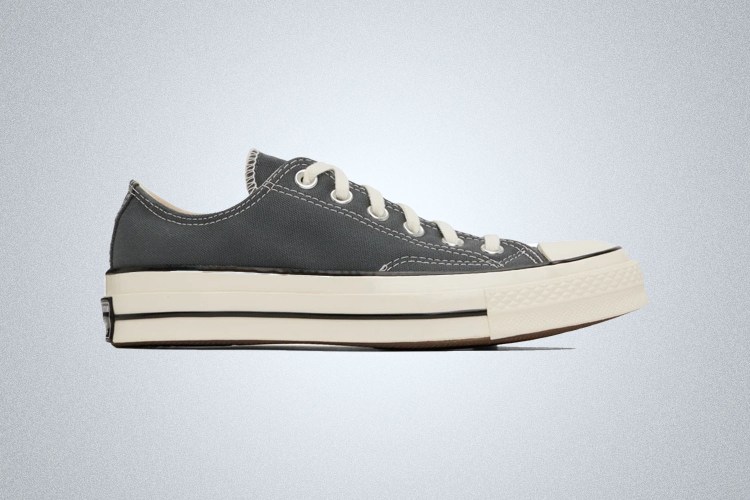 a pair of grey Converse Chuck 70 Low on a grey background