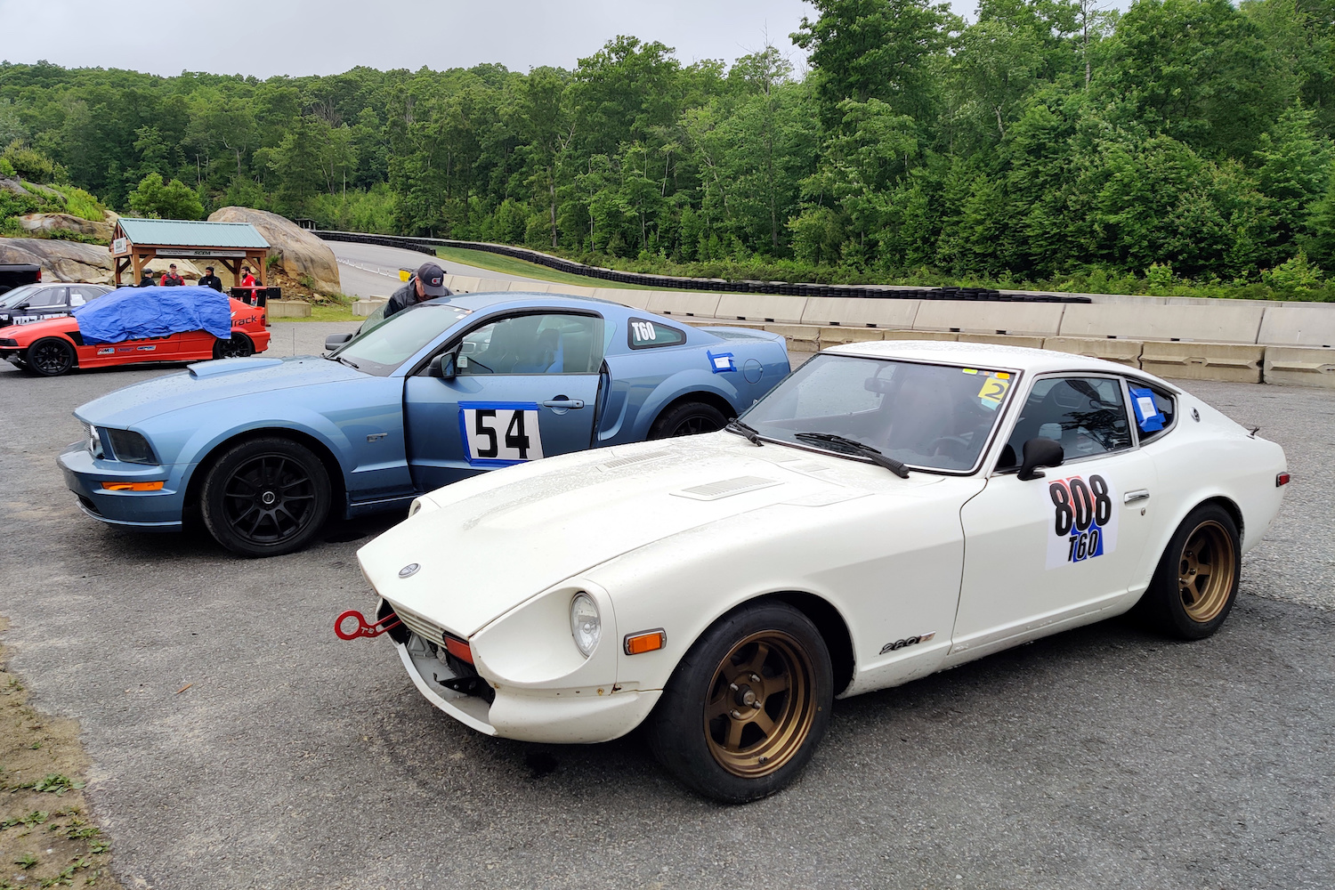 two racecars parked next to each other