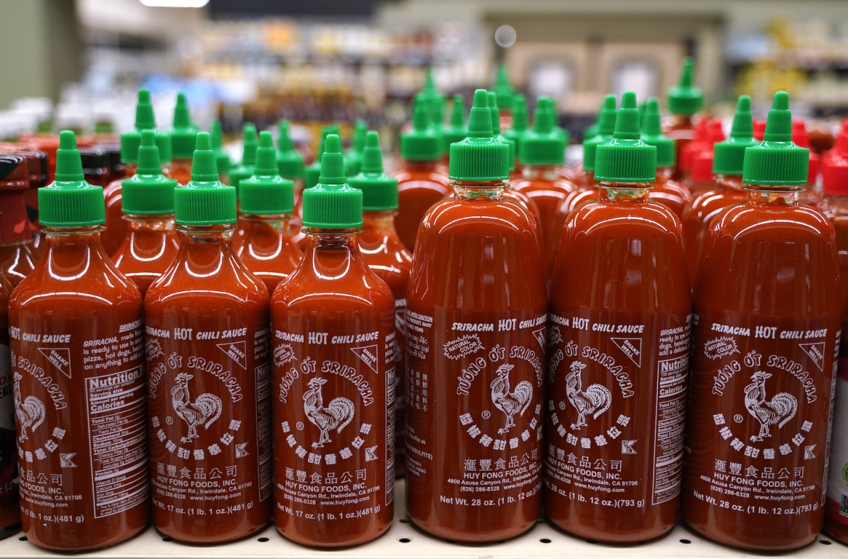 many bottles of Sriracha Hot Chili Sauce