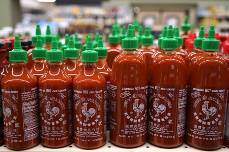 many bottles of Sriracha Hot Chili Sauce