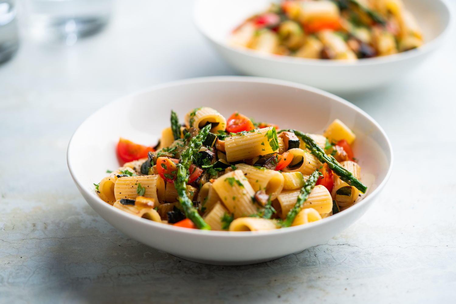 Pasta salad with grilled vegetables, zucchini, eggplant, asparagus and tomatoes