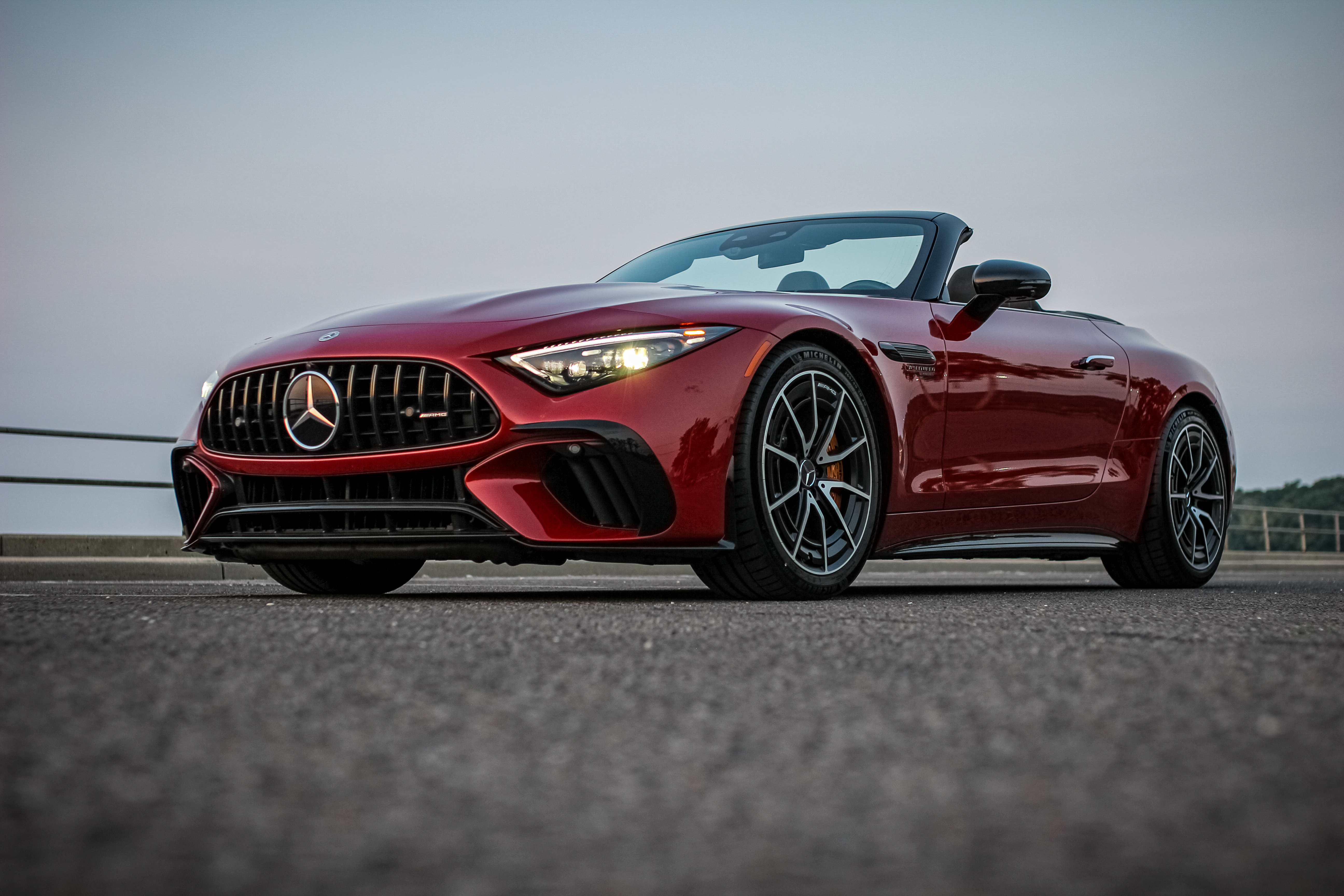 Red car parked on street.