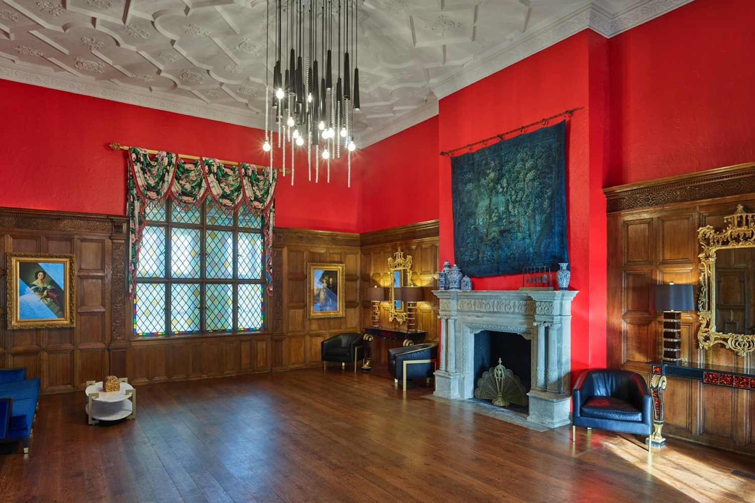 a room with bright red paint and older looking architecture.