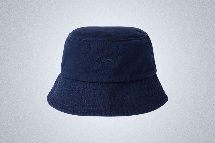 a blue Taylor Stitch Bucket Hat on a grey background