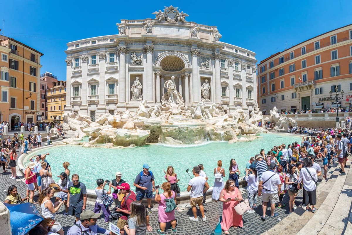 The Trevi Fountain surrounded by tourists