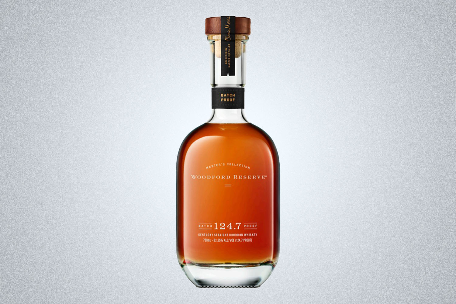 a bottle of Woodford Reserve Batch Proof 124.7 on a grey background