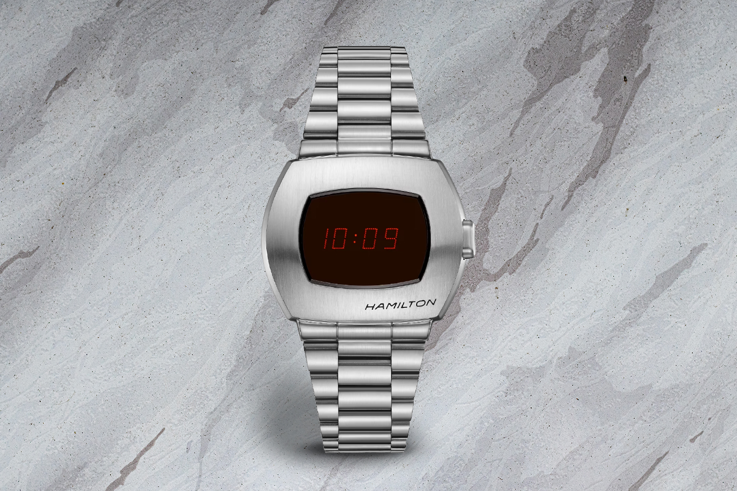 a silver watch with a digital clock.