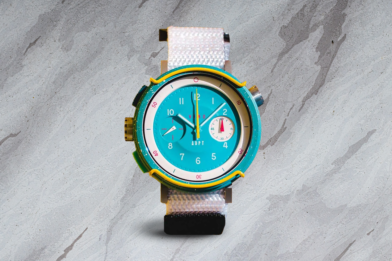 a blue-faced watch with a white wrist