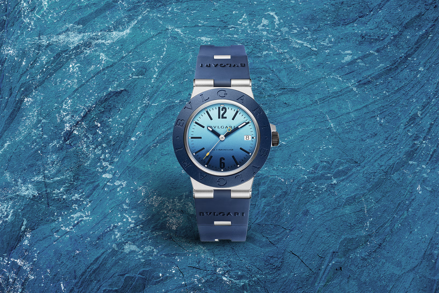 dark blue and silver watch with light blue to dark blue gradient on the watch face