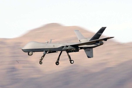 An MQ-9 Reaper remotely piloted aircraft (RPA) flies by during a training mission at Creech Air Force Base on November 17, 2015 in Indian Springs, Nevada. The Air Force denies an AI drone "killed" its human operator during a simulated mission.