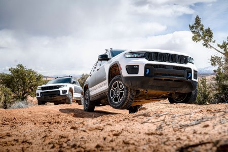 Two Jeep Grand Cherokee 4xe SUVs with autonomous off-road tech driving in Moab, Utah