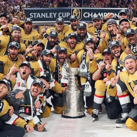 Members of the Vegas Golden Knights pose with the Stanley Cup.