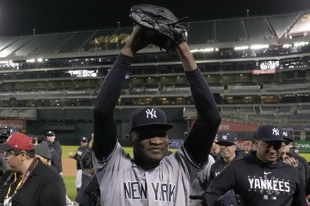 Yankee pitcher Domingo German celebrates his perfect game against the Oakland Athletics.