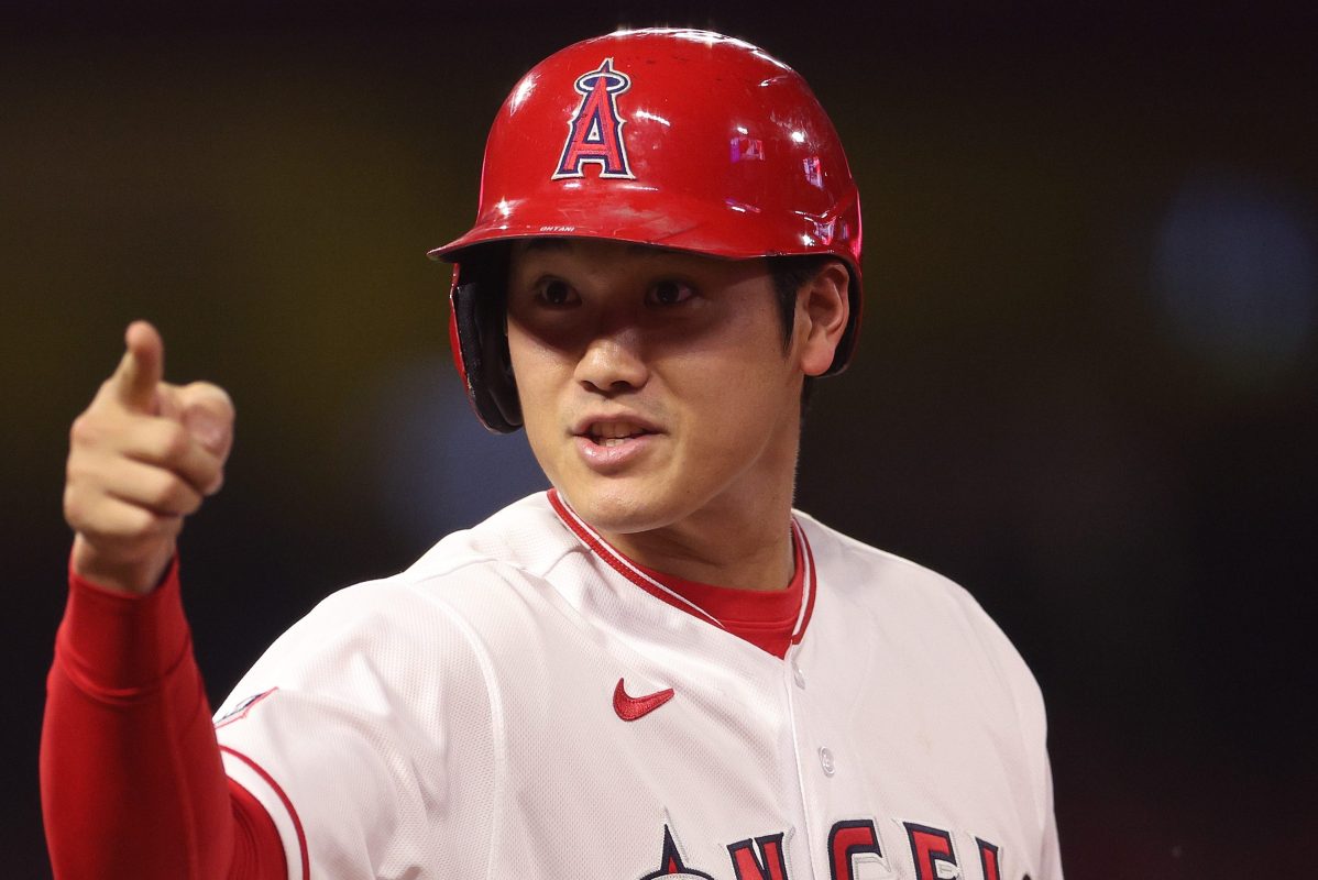 Shohei Ohtani reacts after getting a hit.