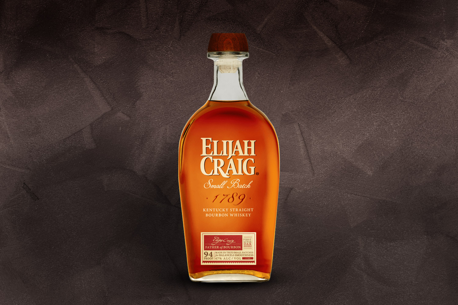 a bottle of elijah craig small batch on a grey background