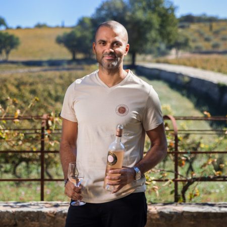 Tony Parker in front of a French vineyard.