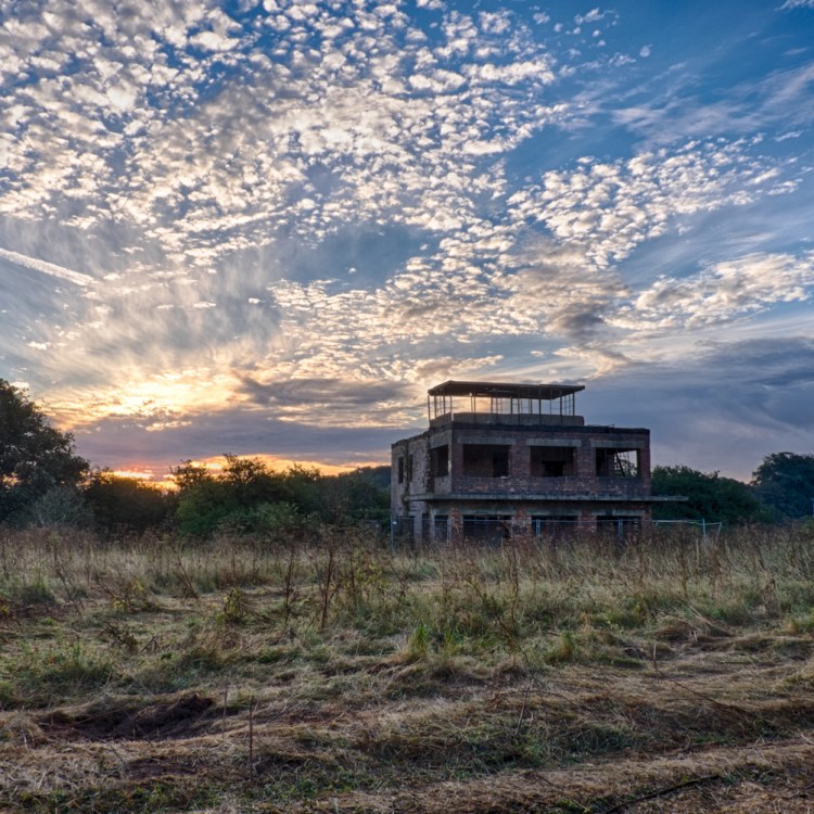 An abandoned military air base at sunrise in the U.K. A similar structure is set to be converted into a residence.