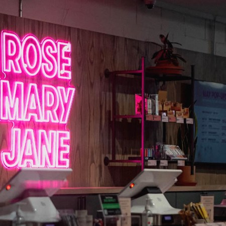 Neon pink sign saying "Rose Mary Jane"