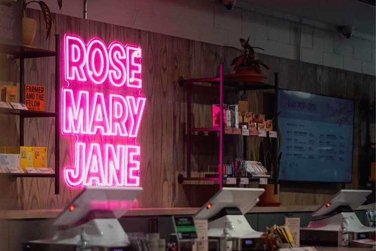 Neon pink sign saying "Rose Mary Jane"