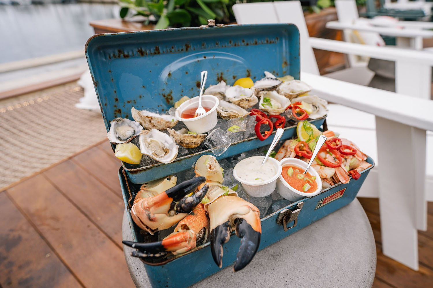 Assorted seafood on ice in a toolbox.