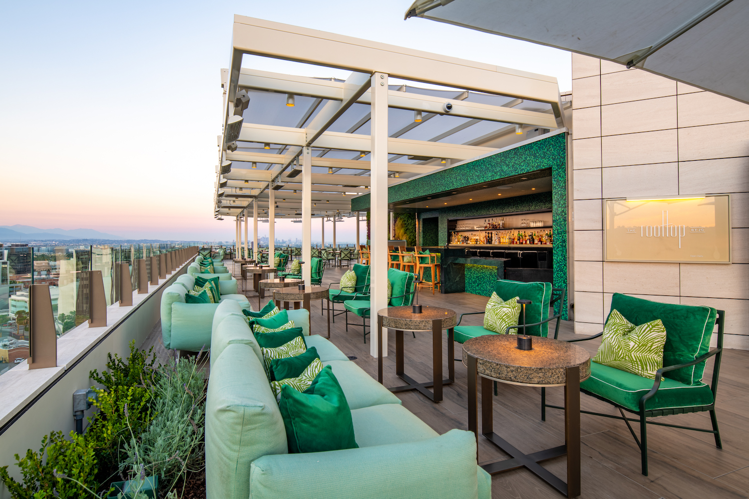 rooftop bar with green color scheme.