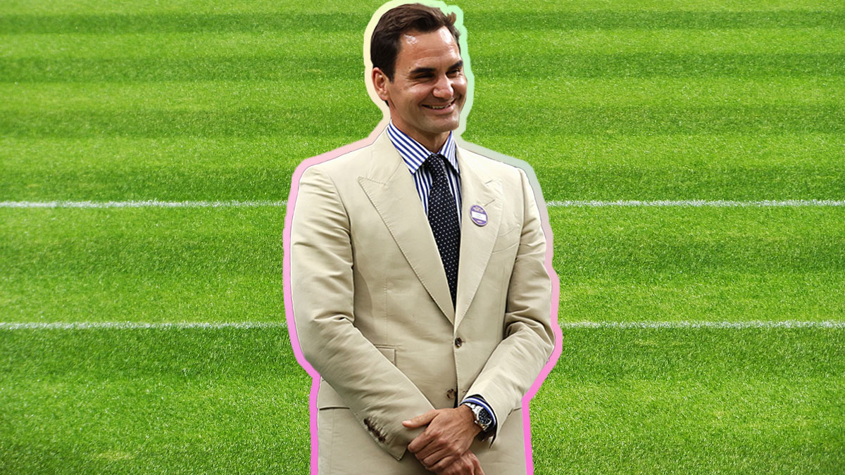A photo of Roger Federer in a tan suit on a grassy court background