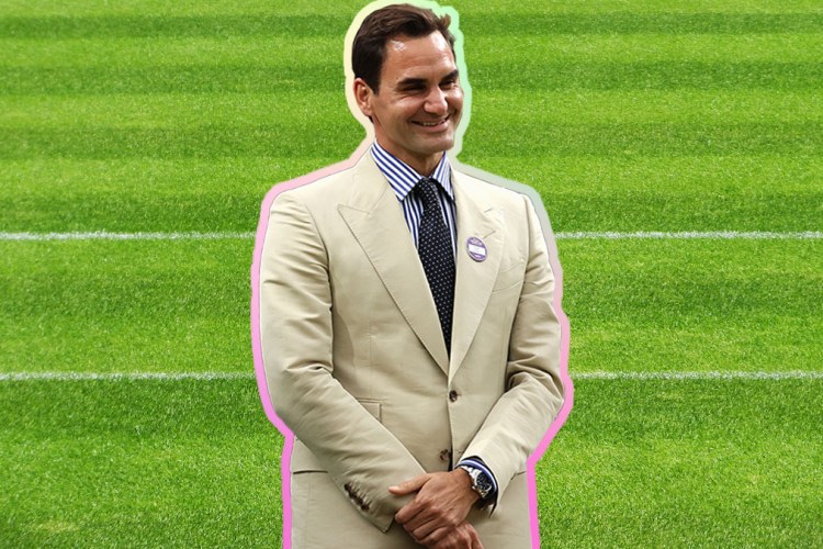 A photo of Roger Federer in a tan suit on a grassy court background