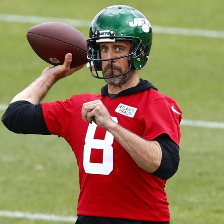 Aaron Rodgers of the New York Jets throws a pass at OTAs
