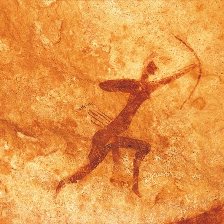 carving of figure with bow and arrows