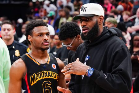 Bronny James talks to his dad LeBron James at a high school All-Star game.