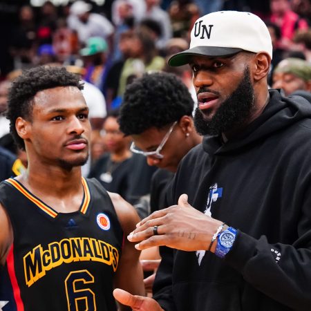 Bronny James talks to his dad LeBron James at a high school All-Star game.