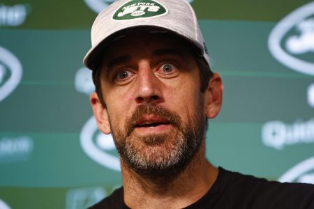 Aaron Rodgers talks to reporters in June.