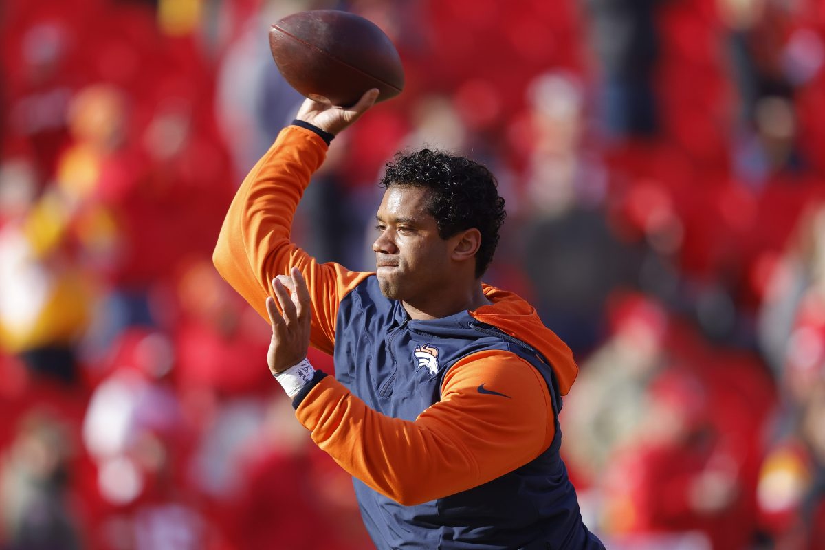 Russell Wilson warms up prior to a Broncos game.