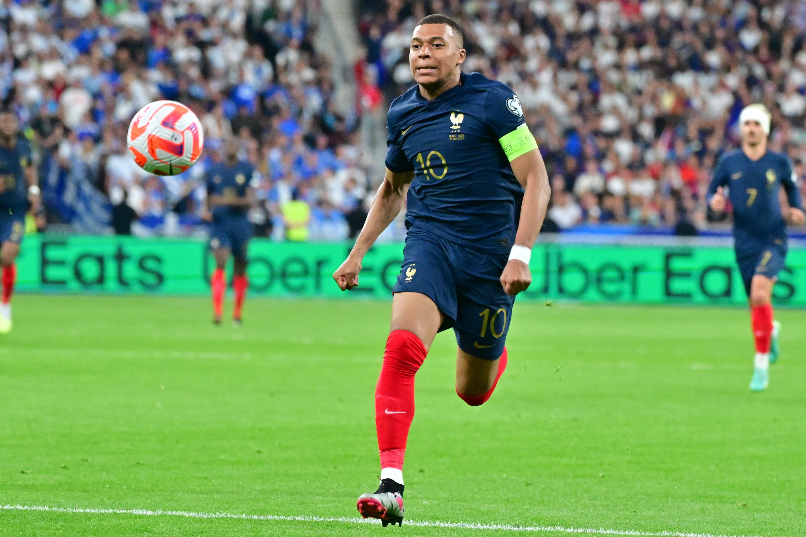 Kylian Mbappé of France goes for the ball during a match against Greece.