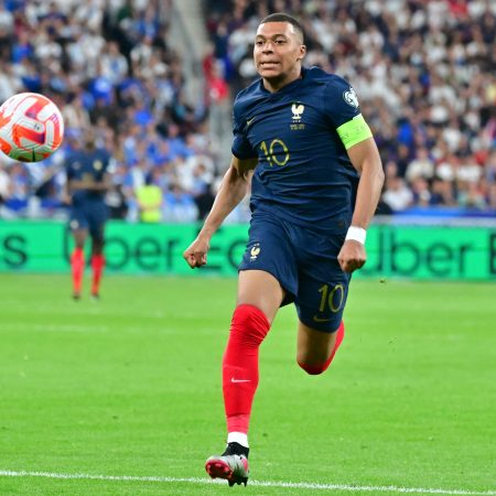 Kylian Mbappé of France goes for the ball during a match against Greece.