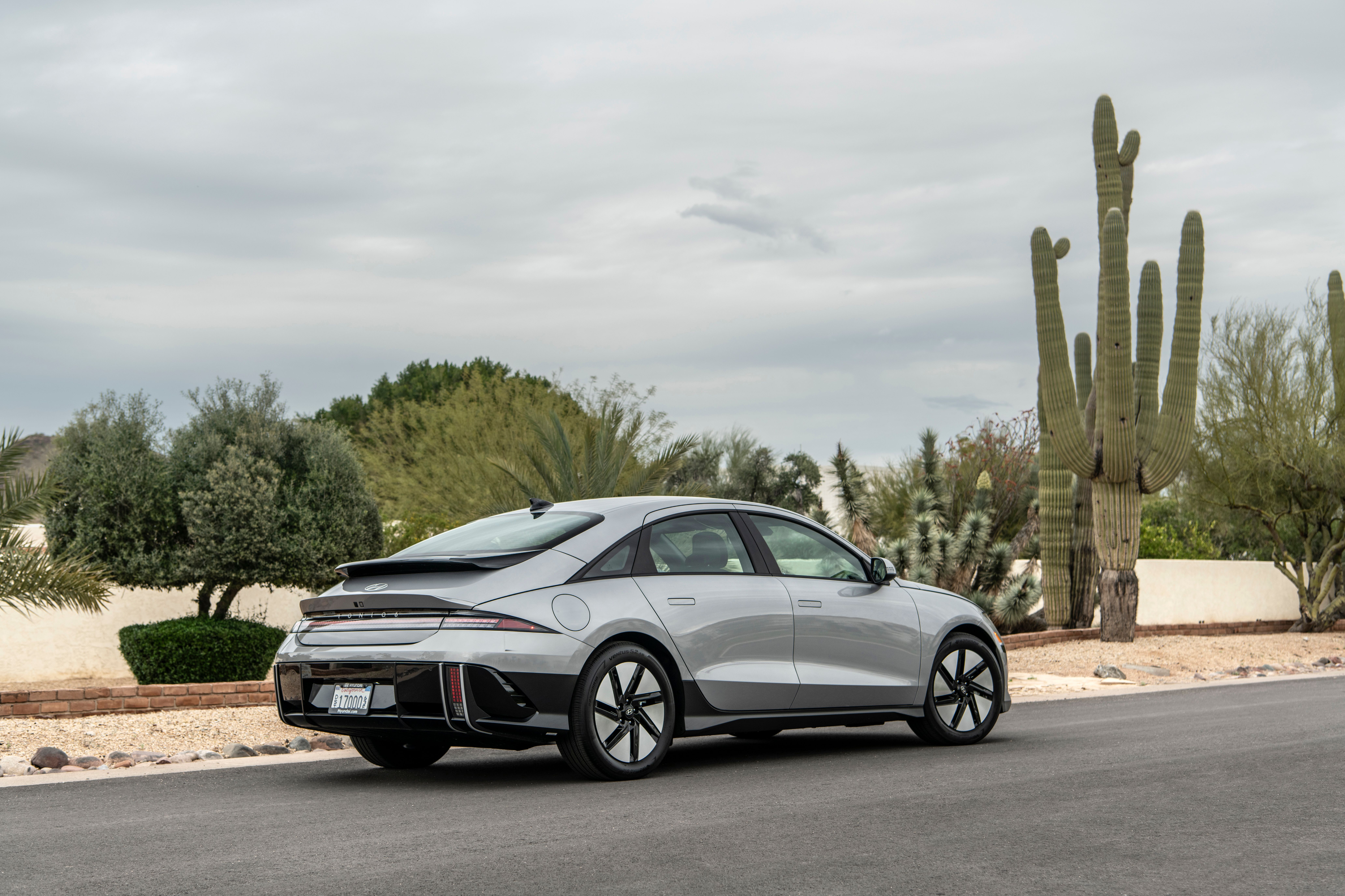 The 2023 Hyundai Ioniq 6 EV in gray, parked in a desert setting