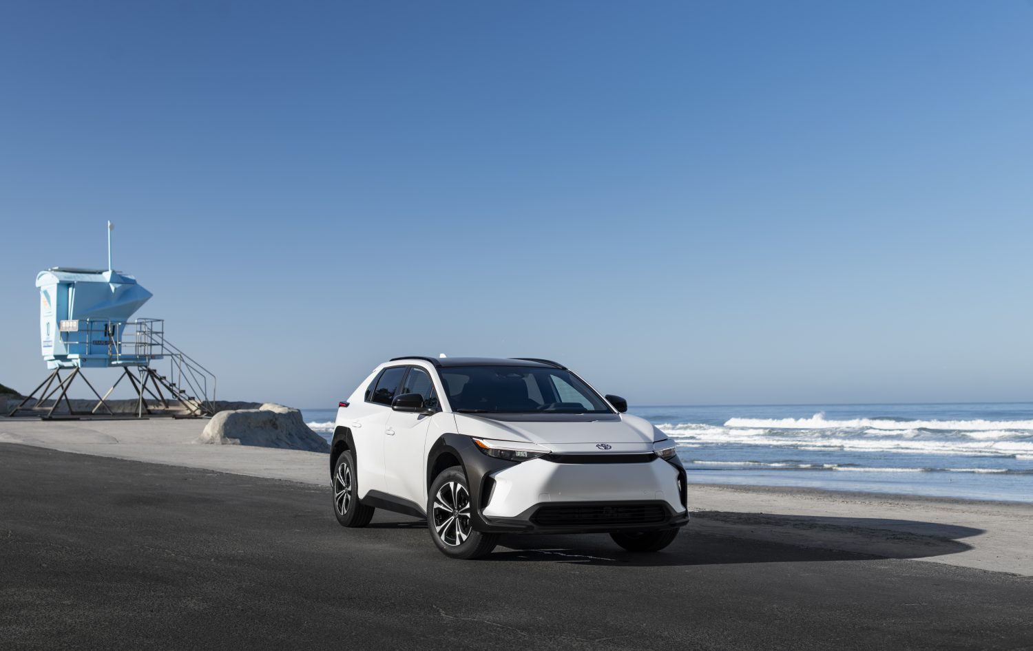 The 2023 Toyota BZ4X in white parked on a beach
