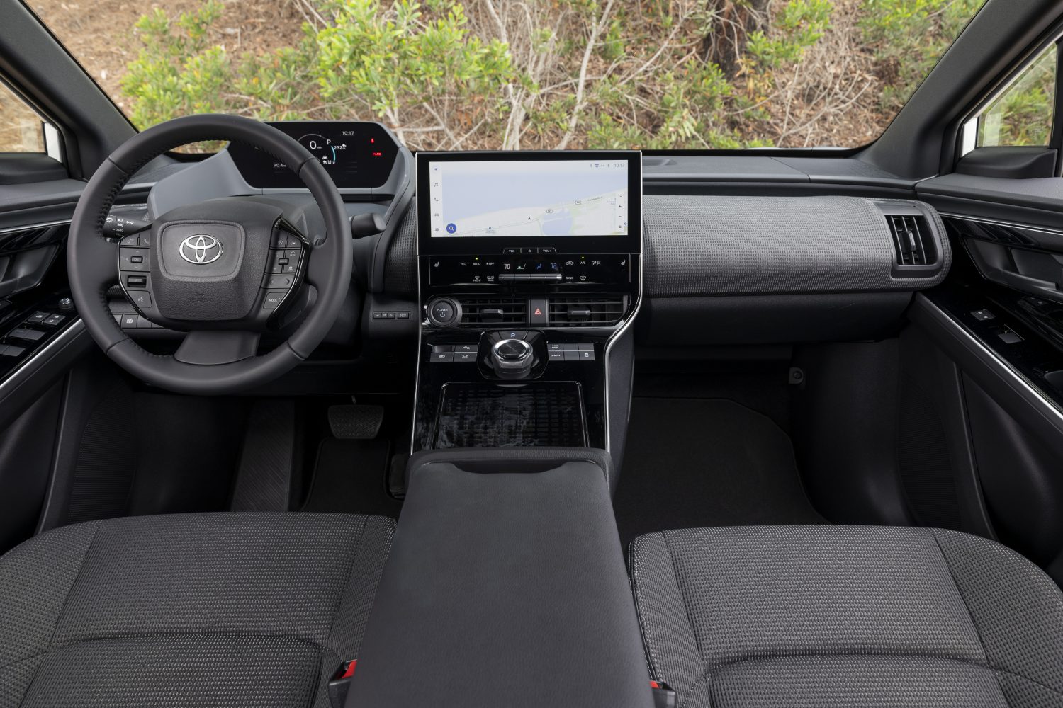 The front seating area and dashboard of the Toyota BZ4X