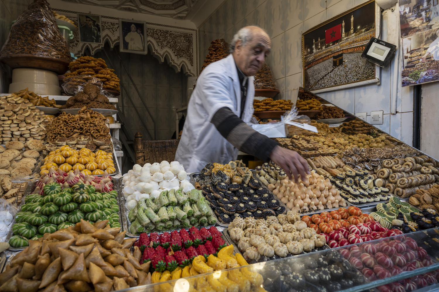 A pastry chef sells typical Moroccan sweets in The Medina