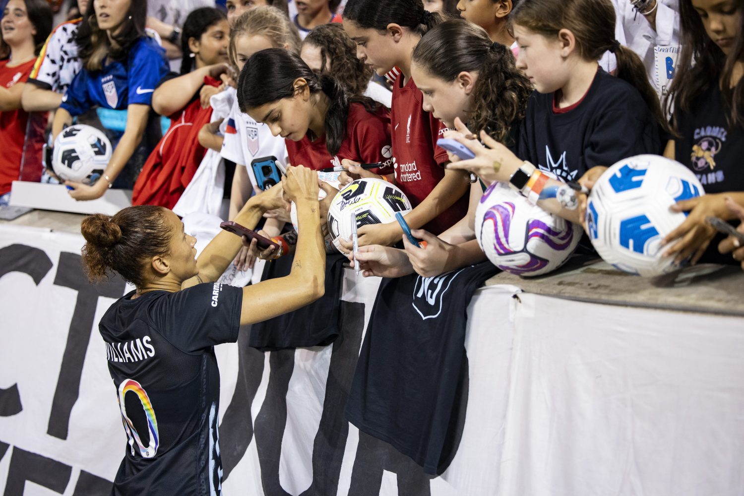 HARRISON, NEW JERSEY - JUNE 25: Lynn Williams #10 of NJ/NY Gotham FC signs autographs for fans at the 2023 FIFA World Cup Send Off before she heads out for the FIFA World Cup and after the National Womens Soccer League Match against the Chicago Red Stars at Red Bull Arena on June 25, 2023 in Harrison, New Jersey. (Photo by Ira L. Black - Corbis/Getty Images)
