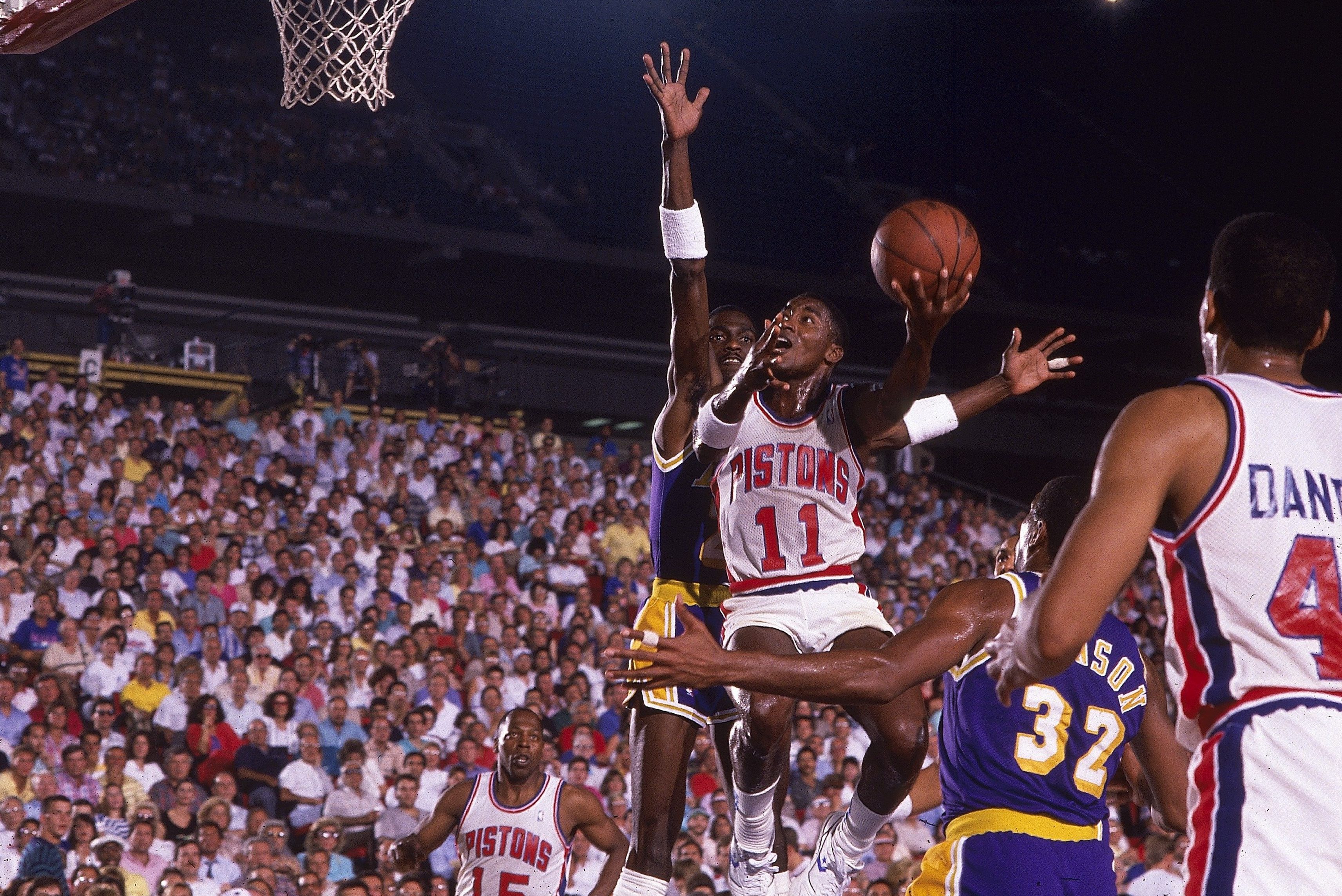 Isiah Thomas takes the ball to the hoop against the Los Angeles Lakers.
