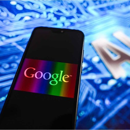 In this photo illustration, a Google logo displayed on a smartphone with Artificial Intelligence (AI) design in the background. google has been working on using its AI to create a virtual life coach