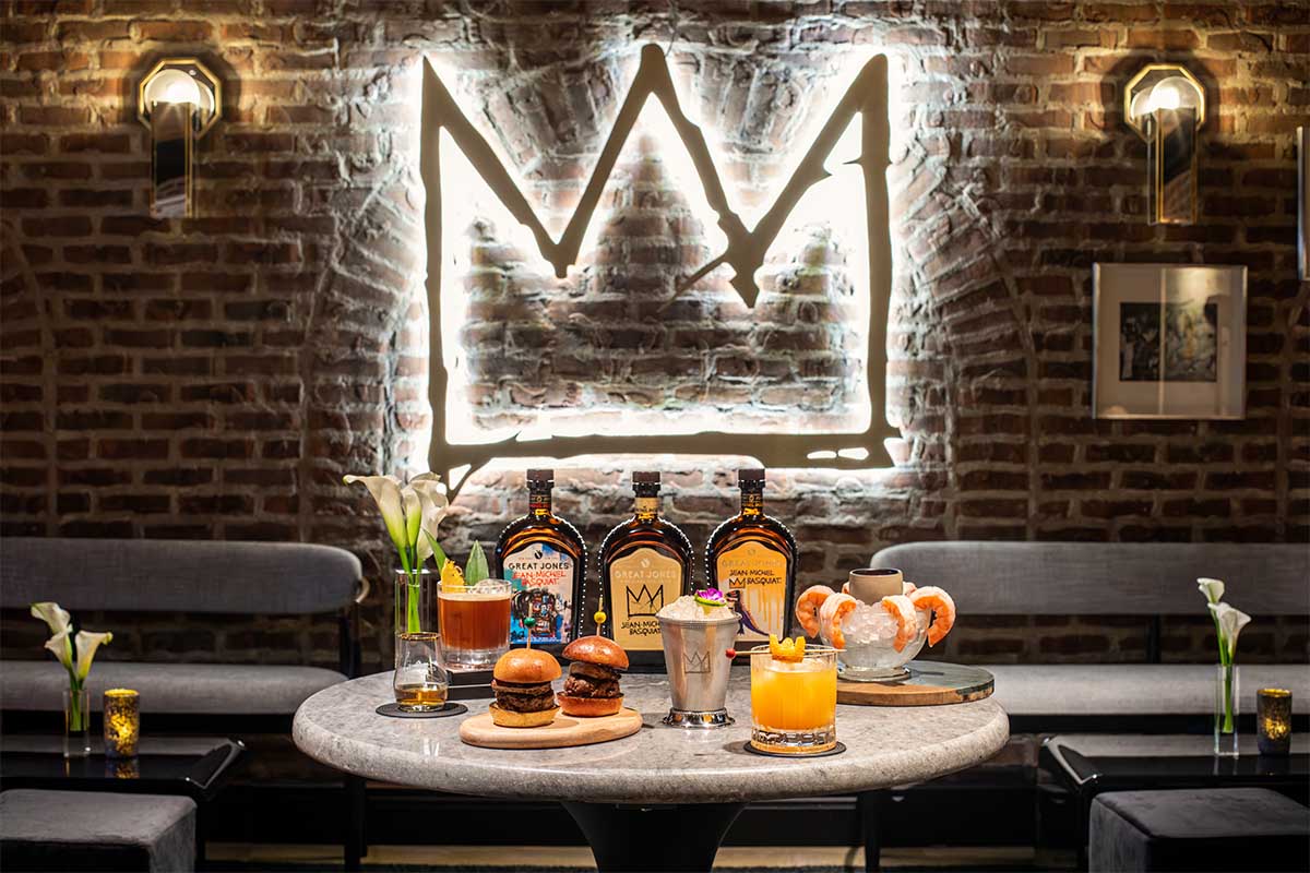 The new bottles of whiskey, food options, cocktails and more at the Basquiat pop-up speakeasy at Manhattan's Great Jones Distiling