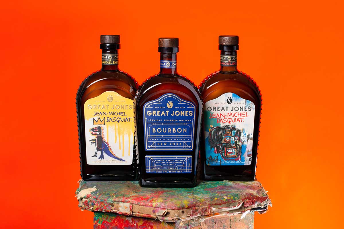 Two of the Basquiat-themed bottles from Great Jones and the bourbon brand's core release