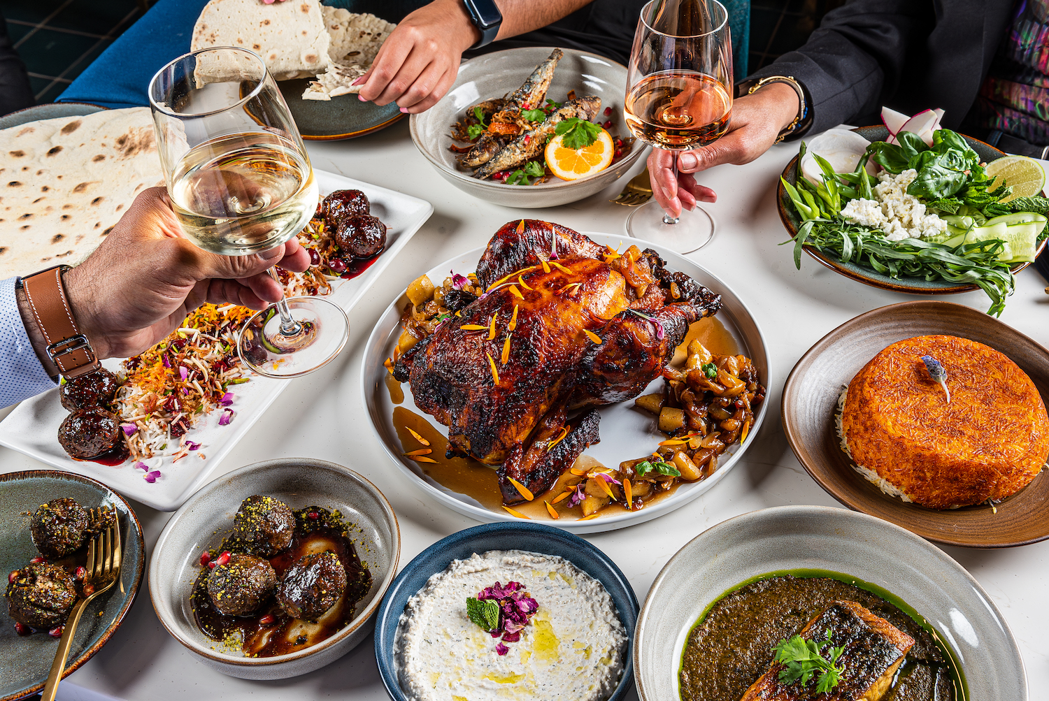 Spread of food and wine glasses on a table