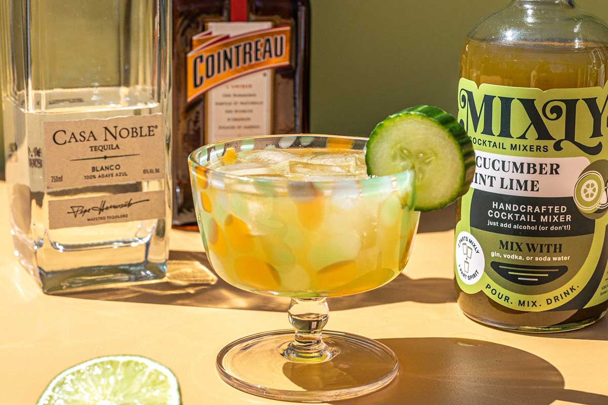 A cucumber margarita made with bottles of Mixly and Casa Noble tequila
