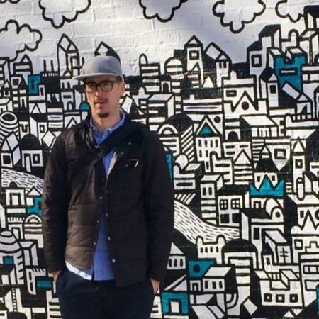 Local Chicago artist Nate Otto in front of mural