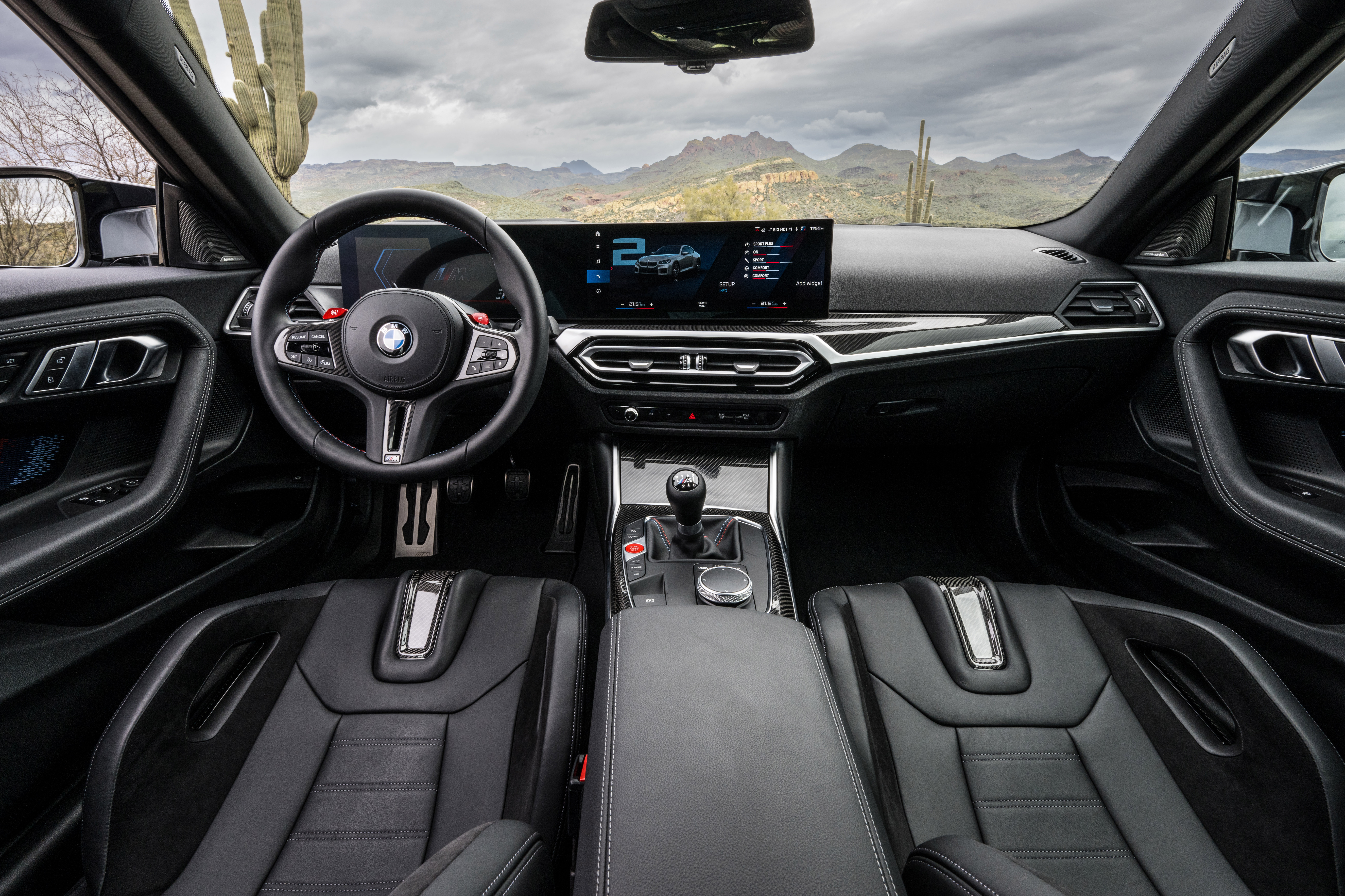 The 2023 BMW M2 front seating area and dash